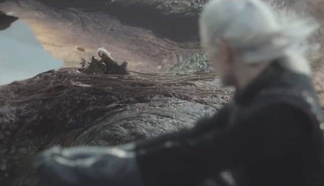 Daemon and Laena riding their respective dragons side-by-side, looking across at each other.