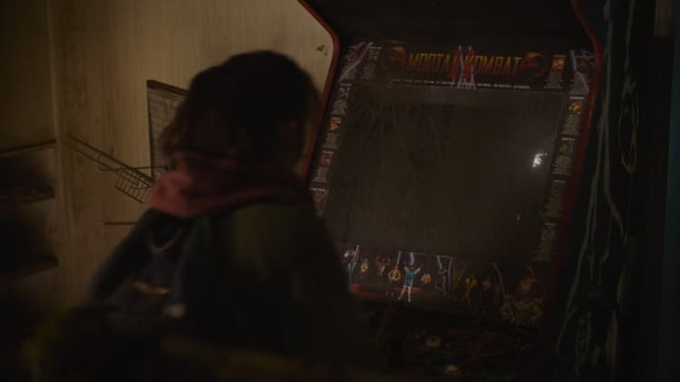 Ellie, excited at seeing a Mortal Kombat arcade machine