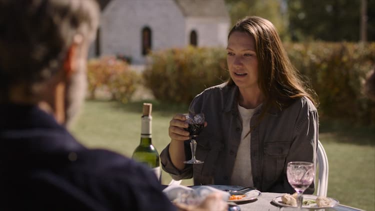 Tess at a garden party with Frank