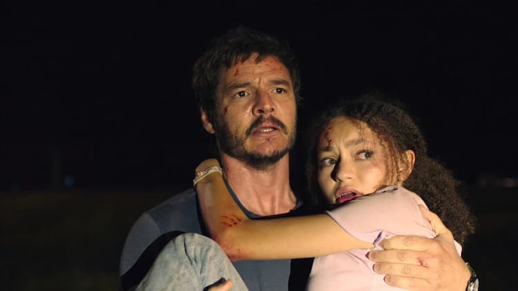 Joel carries an injured Sarah to safety