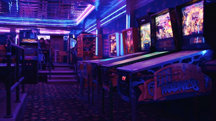 A fully functioning arcade as Ellie and Riley play on a cabinet in the background