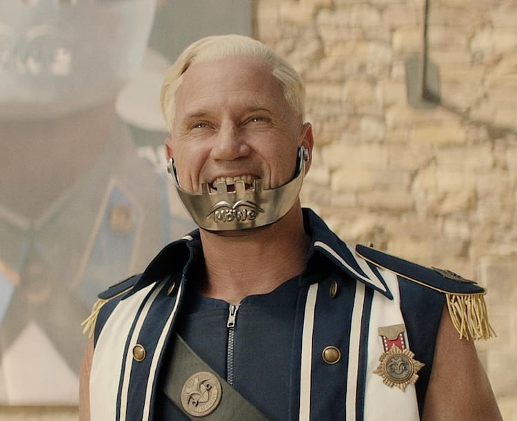 Close up of Captain Morgan with the giant image of himself in the background