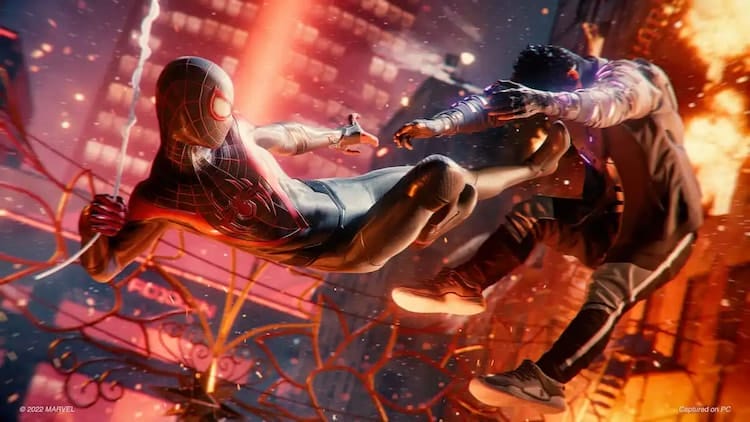 Spider-Man kicking an enemy while fire engulf the background