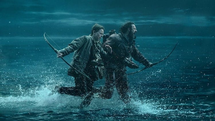 Jamie and Alfie run through ankle-deep water; Jamie is screaming; the rest of the ocean around them makes it look as if they’re walking on water.