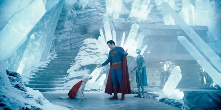 Superman is telling off Krypto in the Fortress of Solitude. There are holes everywhere. The Fortress is made up of crystals. A Superman Robot is standing nearby. Krypto is sitting like a good boy.
