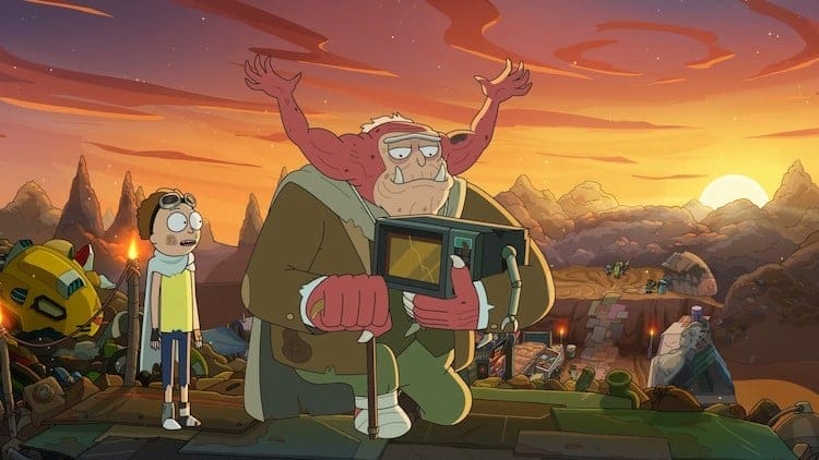 Morty, left, is standing next to Morty Jr., right. Morty Jr. is holding a microwave that has arms and legs.