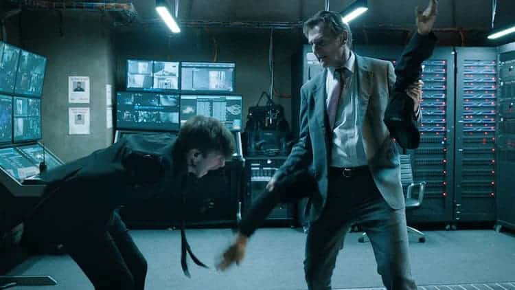 Frank is beating up someone with their own arms. Frank has just hit the guy in the balls with his own left arm. A bunch of screens are in the background.