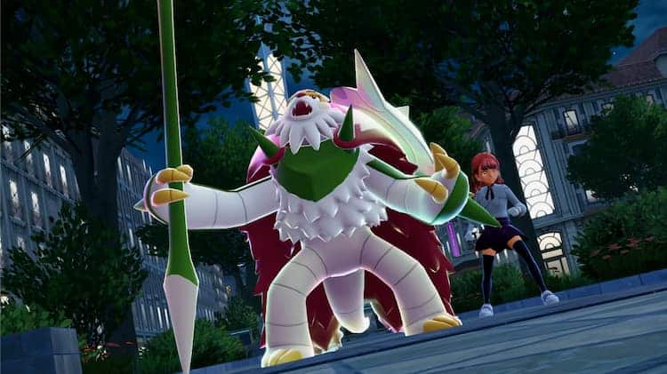 Mega Chesnaught is holding one of its weapons in a park at night. Their trainer is cheering them on.