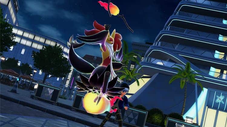 Mega Delphox is floating in an open area. Their trainer is cheering them on.