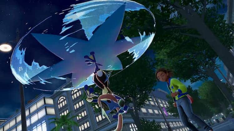 Mega Greninja is upside down in a park. Their trainer is cheering them on.