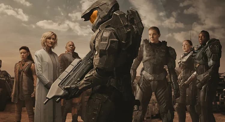 Key art for Season 1 of HALO. Master Chief is in the centre, holding an assault rifle. Kwan, Halsey, and Soren are on the left. Kai, Rizz, and Vanack are on the right in their armour. They are all on a desert planet.