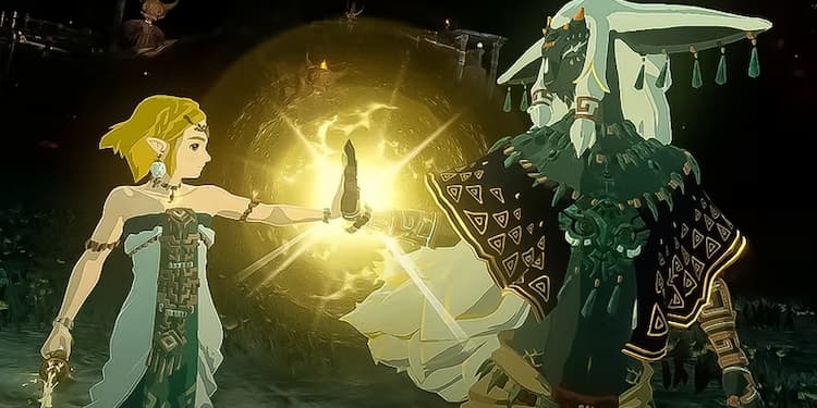 Zelda and one of her companions are placing their hands together. A light shines from where their hands meet. They are in a dark cave.