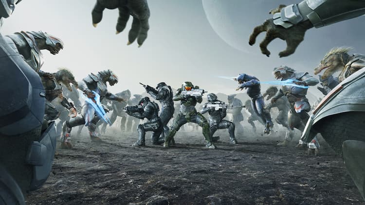Promotional image for HALO. The Spartans of Silver Team are surrounded by the Covenant. The Spartans are all aiming their guns at their enemies. The Covenant are lunging at them. They are on a rocky planet with a large moon in the sky.