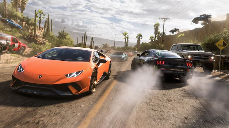 Screenshot from Forza Horizon 5. An orange Lamborghini is driving towards the left of the image. Other cars are driving in the opposite direction. It's a cloudy day with various plants lining the road in the middle of Mexico.