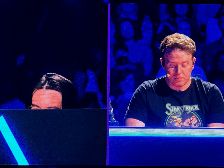 Zac Oyama hiding under his desk while Brennan Lee Mulligan DMs him