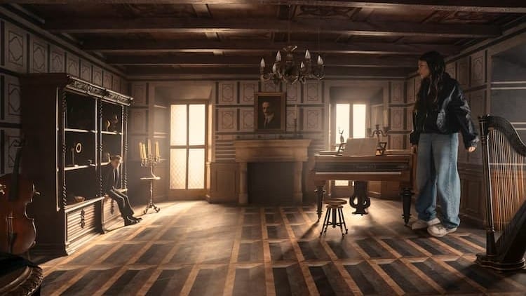 Jack and June are in a room that messes with perception. Jack is on the left and appears tiny. June is on the right and appears giant. Light is coming in through two windows.