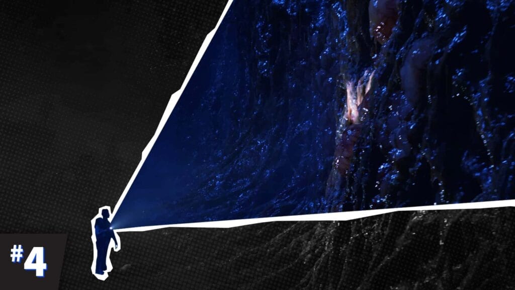 Eleven and Hopper stand before a giant fleshy wall in the Upside Down, dim bioluminescent veins pulsing.