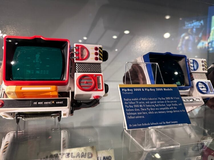 Two Pip-Boys from the Fallout franchise are on display.