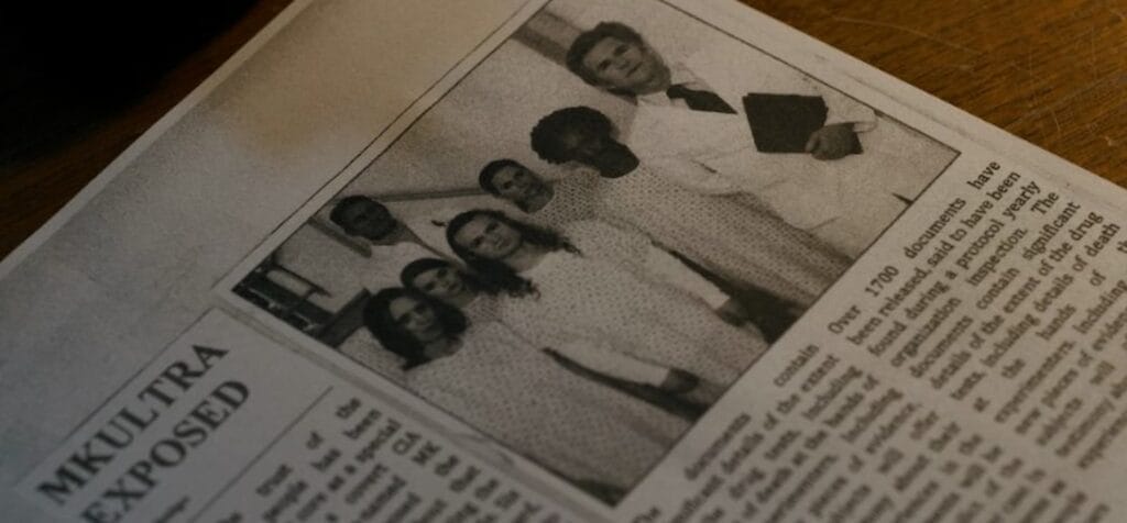 A black‑and‑white newspaper clipping titled “MKULTRA Exposed,” showing a younger Dr. Brenner in connection with a front‑page story about the secret CIA mind‑control program and its alleged experiments on test subjects.