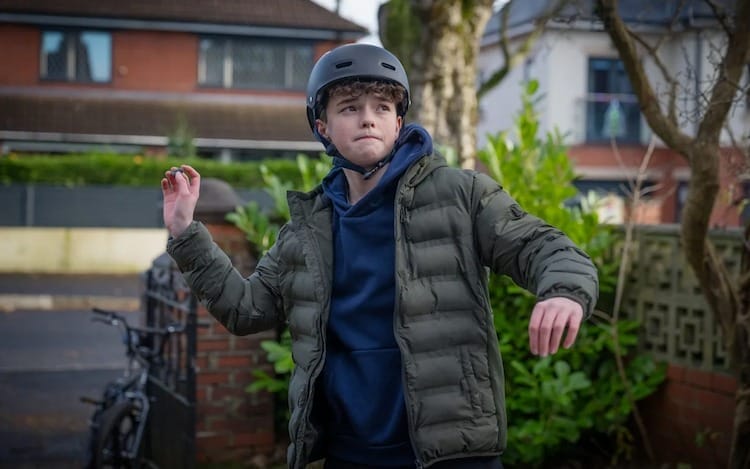 Callum is about to throw a stone.