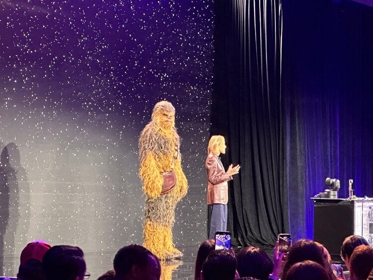 The LEGO presentation at CES. Chewbacca is standing next to a member of the LEGO team.
