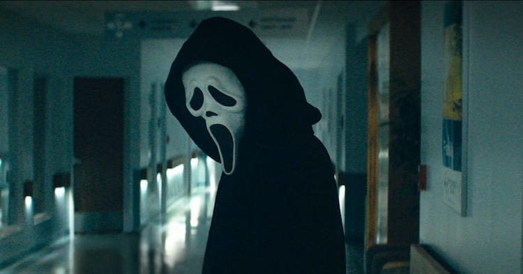 Ghostface is standing in a hospital corridor