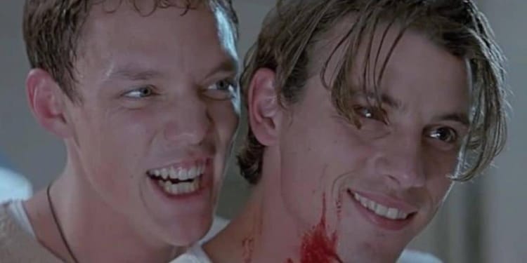 Stu, left, and Billy, right, are both smiling manically.